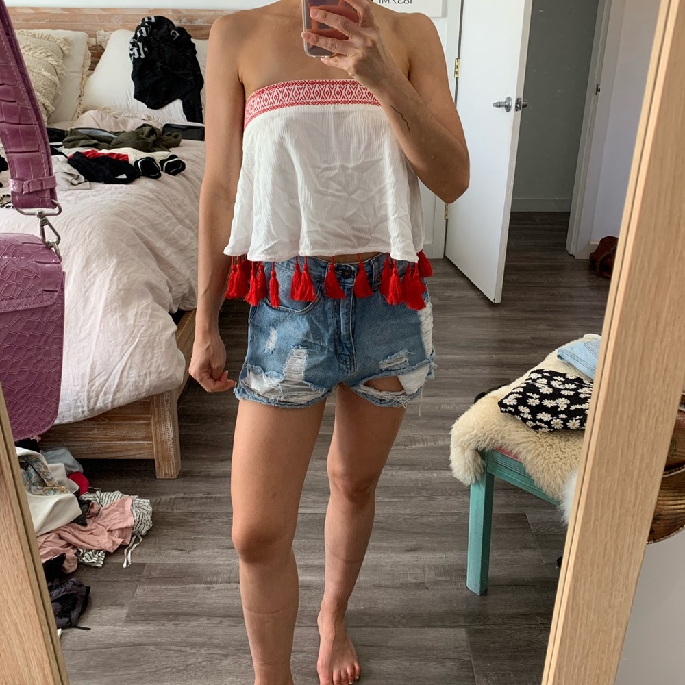 Show me your Mumu strapless top with tassels.